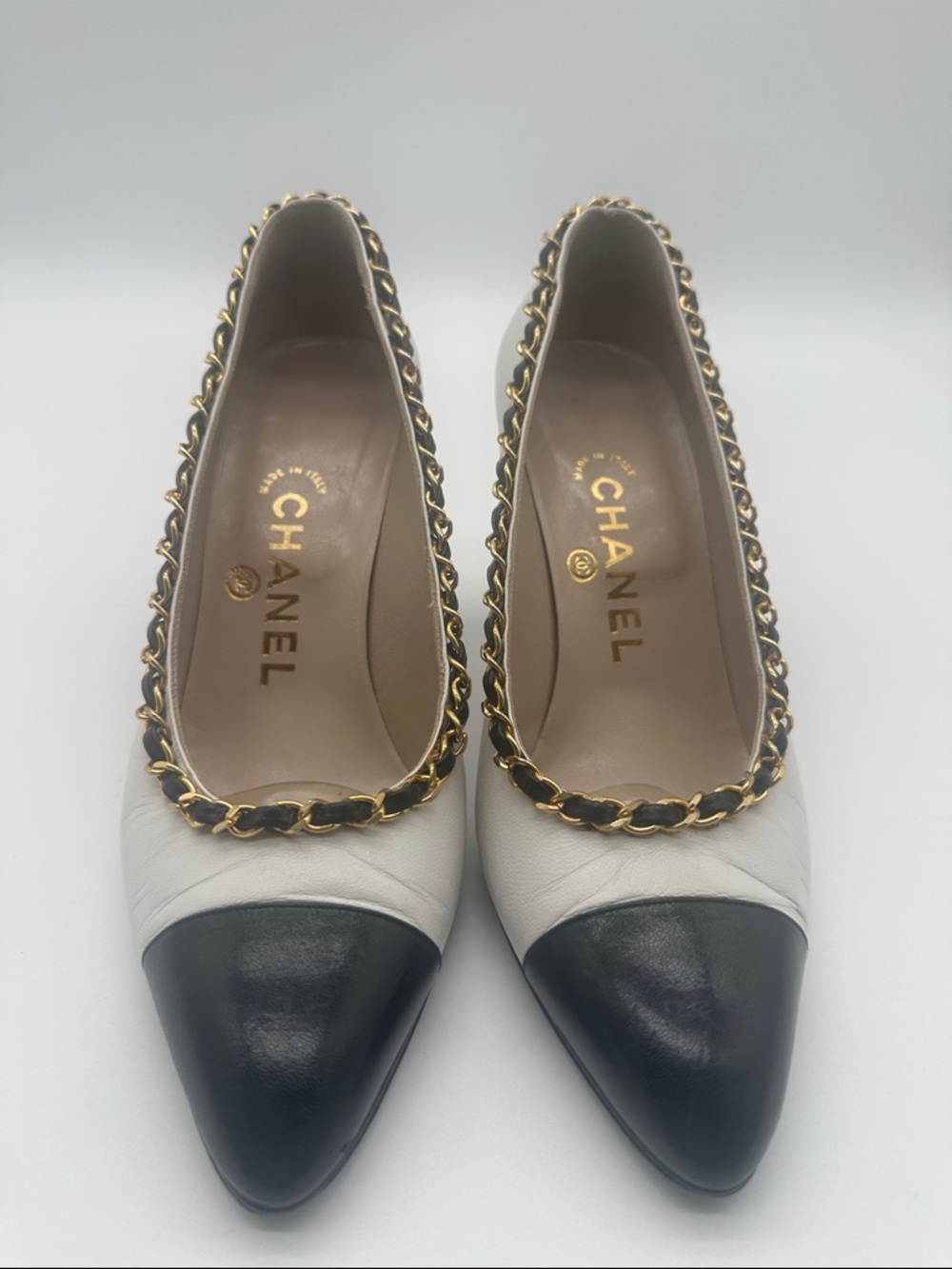 CHANEL Two-Tone Leather Pointed Toe Flats in White and Black
